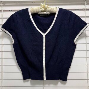 Merckeety Women's navy v-neck crop top with contrasting white trim; Size L